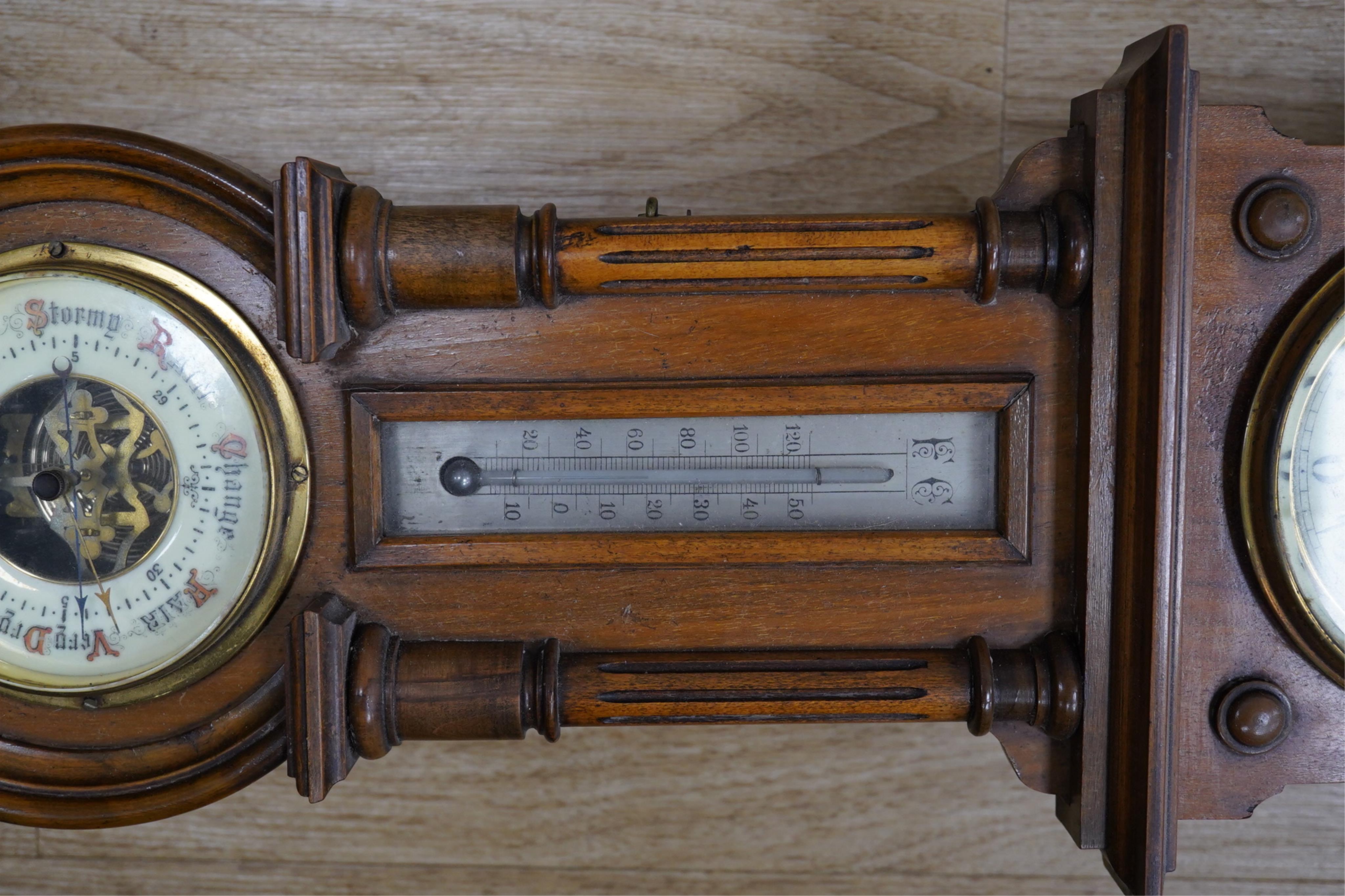 A late 19th century walnut wall clock, barometer and thermometer combination, striking on a coiled gong, 65cm high. Condition - fair, crack to the case and finial missing to the bottom